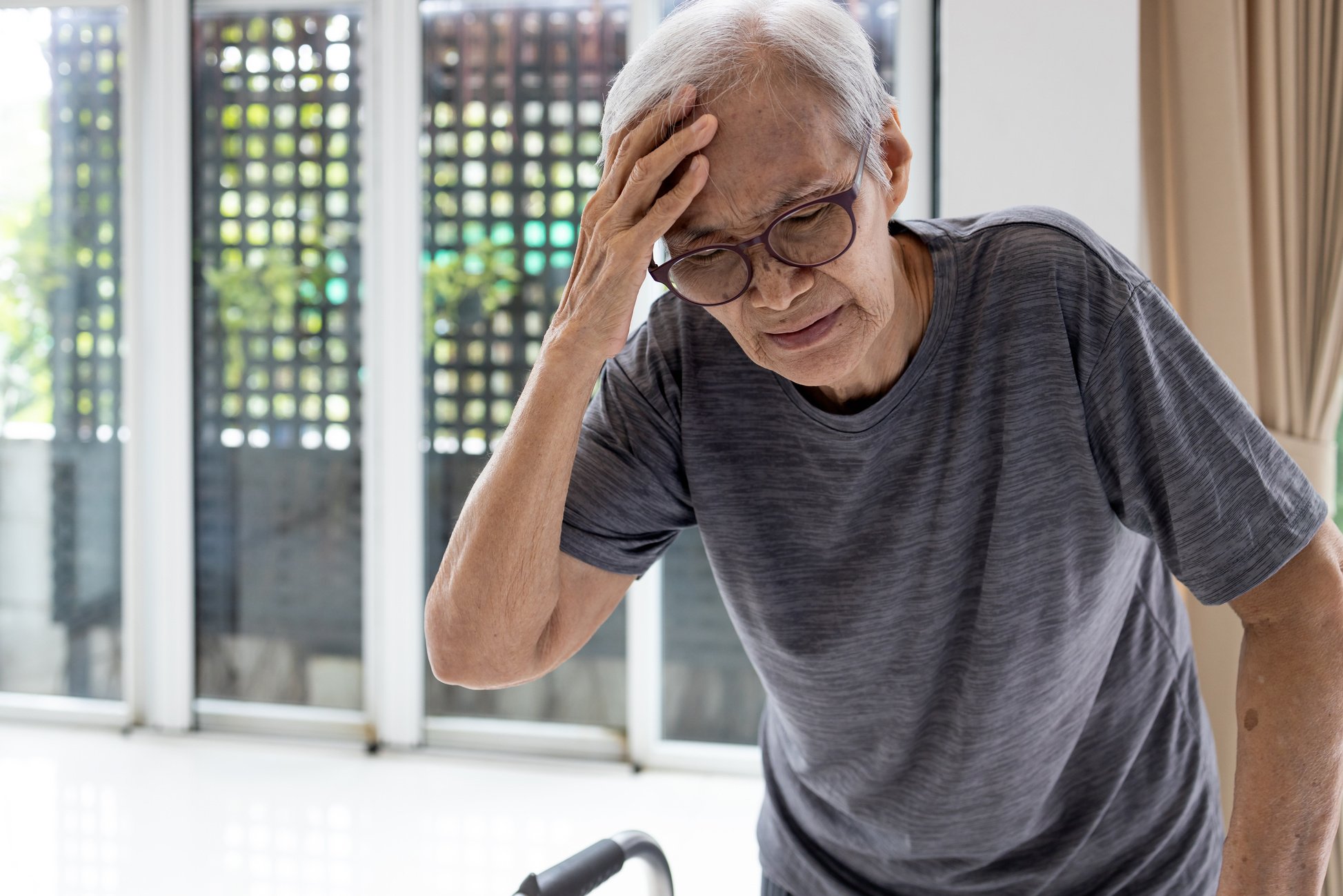 Tired Asian Senior Woman Touch Her Head with Hand,Symptoms of Ve